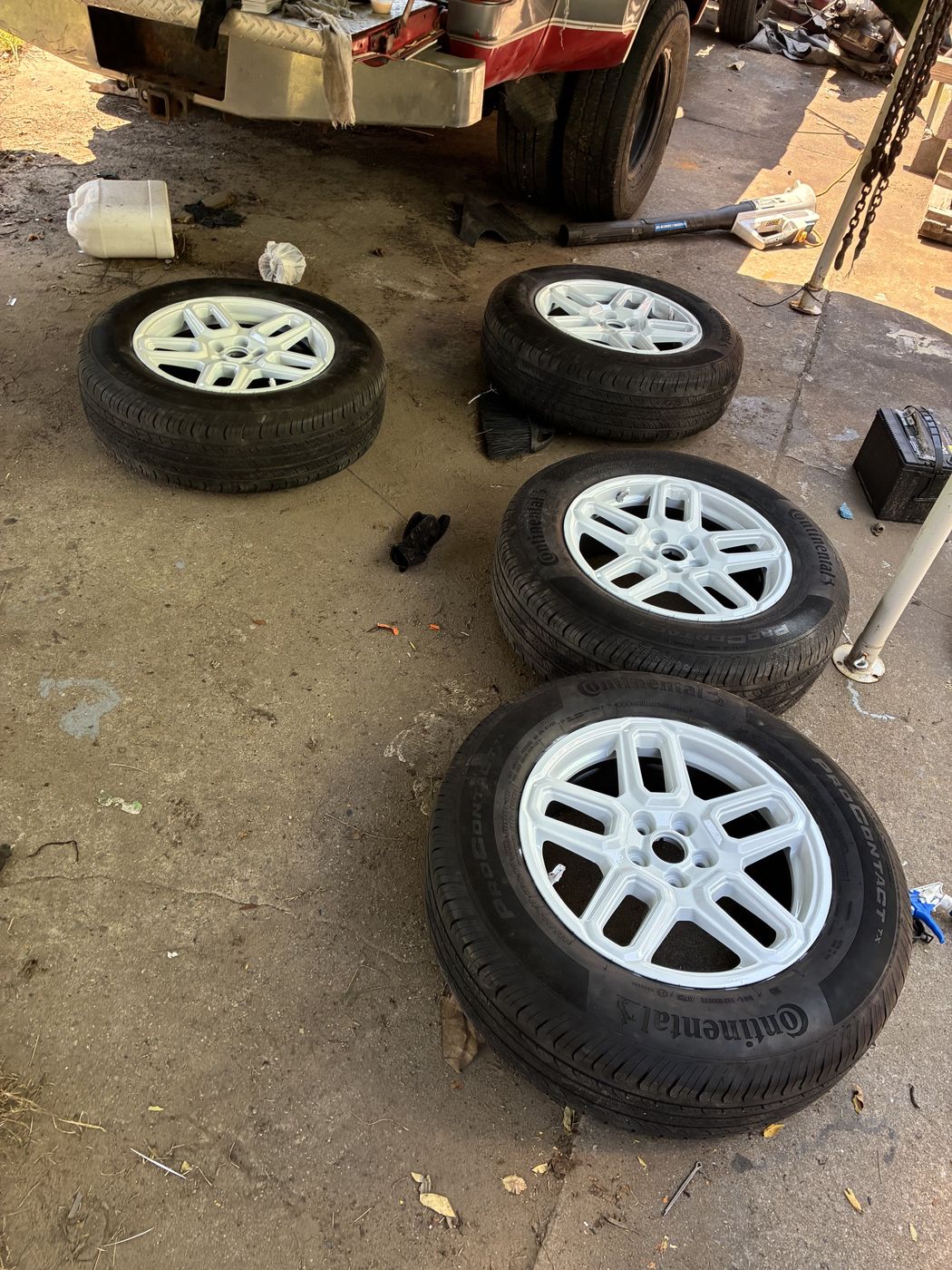 Wheels and tires off a car for brake service