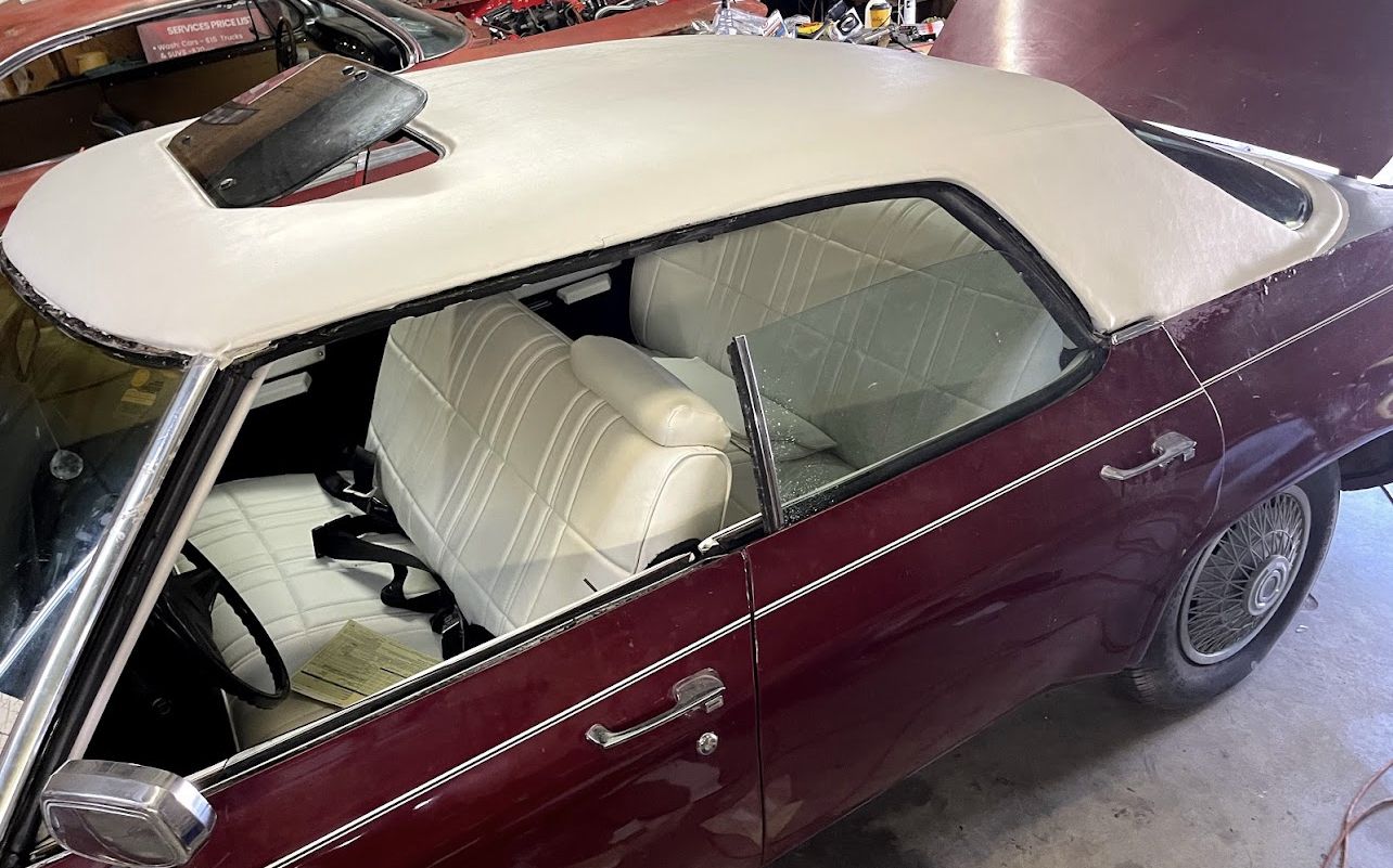 Convertible top and cream interior on a classic car