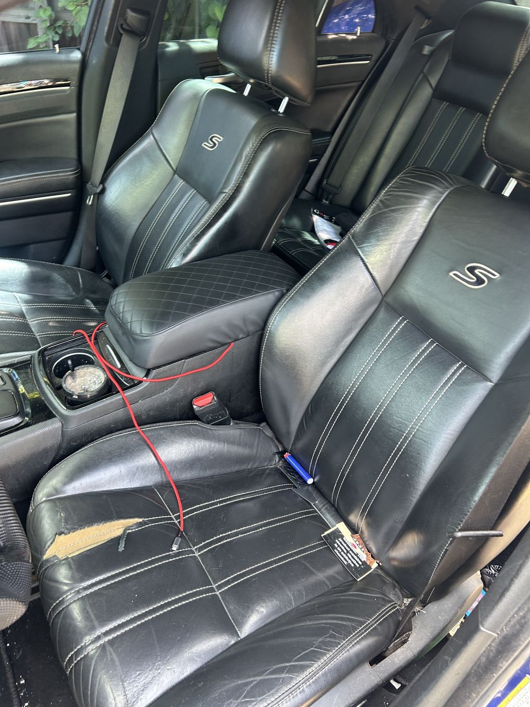 Black leather seats in a Chrysler